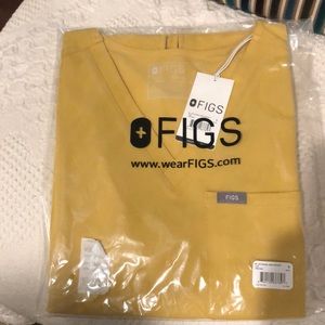 Figs Catarina one pocket scrub top size small.  Gold color as shown.  Brand new